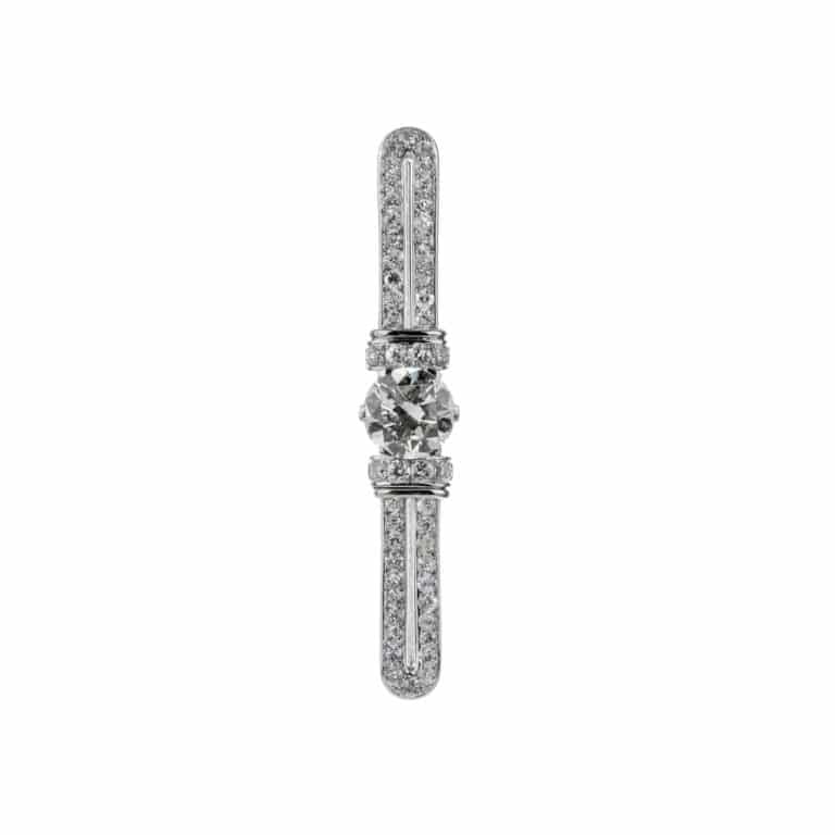 Bijoux Vintage - Broche or blanc et platine un diamant central entouré de diamants