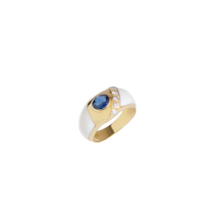Vintage Jewelry - Vintage ring in yellow gold composed of 2 ivory elements, set in the center with an oval sapphire and 6 diamonds